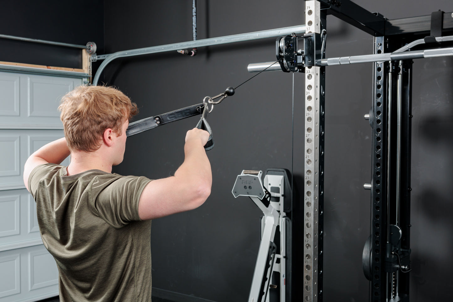 Rep Fitness - Altitude Power rack with smith machine and functional trainer man doing face pulls - Gym Equip