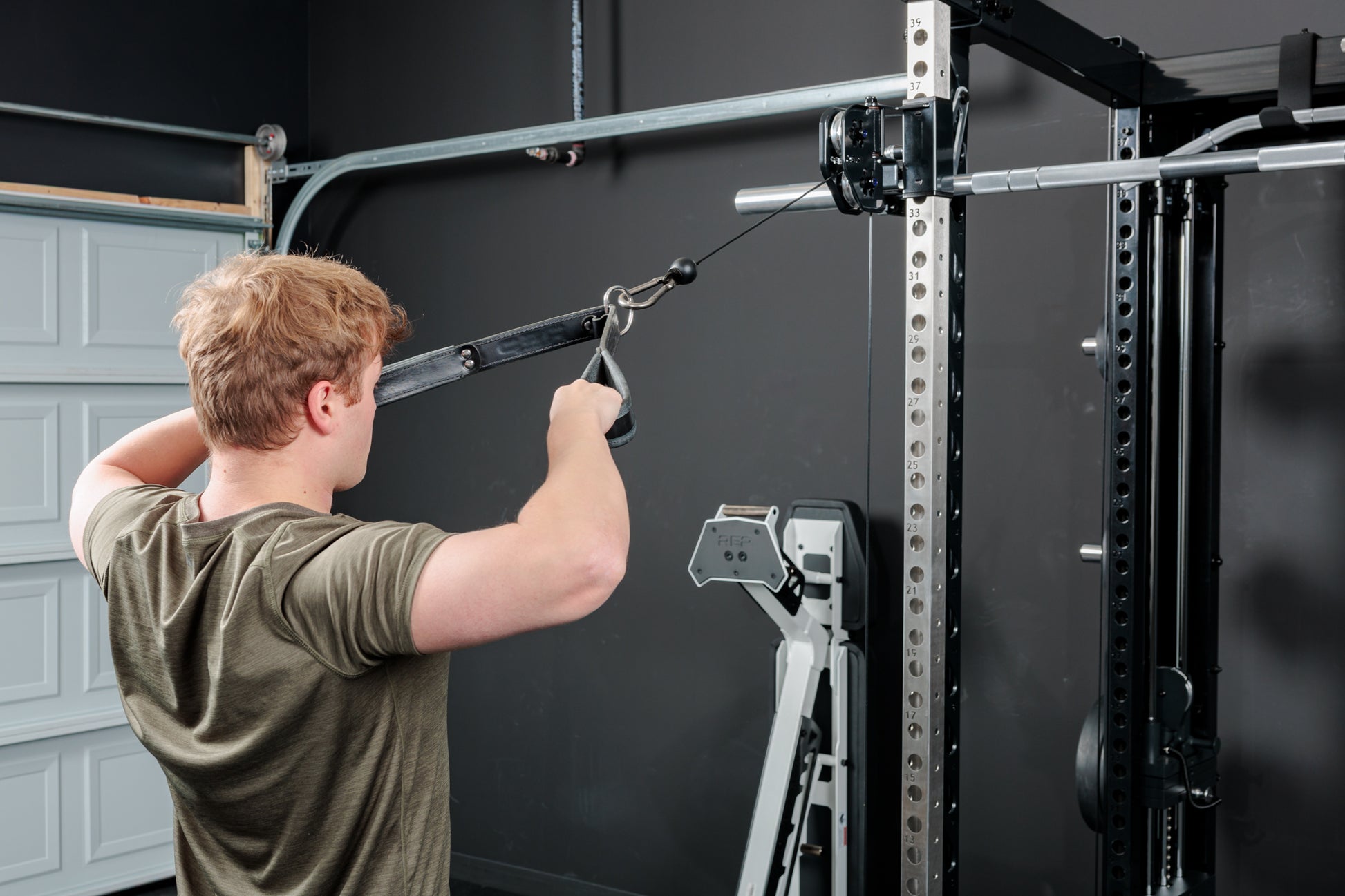 Rep Fitness - Altitude Power rack with smith machine and functional trainer man doing face pulls - Gym Equip