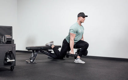 Rep Fitness - Nighthawk Adjustable bench being used for bulgarian split squats with Rep X Pepin dumbbells - Gym Equip