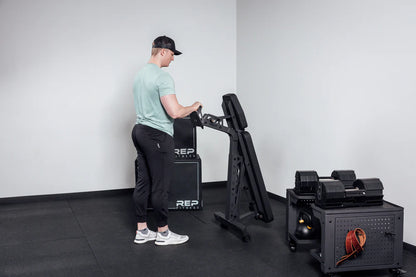 Rep Fitness - Nighthawk Adjustable bench being wheeled around - Gym Equip