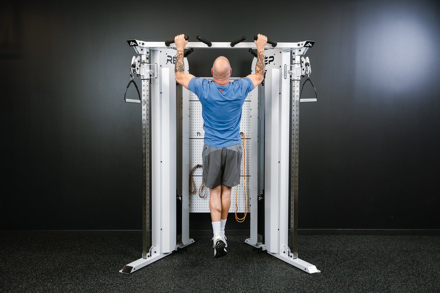 Rep Fitness - Arcadia Max functional trainer being used for pull ups - White - Gym Equip