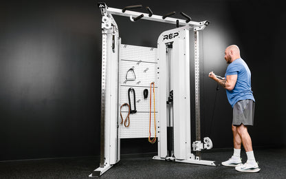 Rep Fitness - Arcadia Max functional trainer being used for bicep curls - White - Gym Equip
