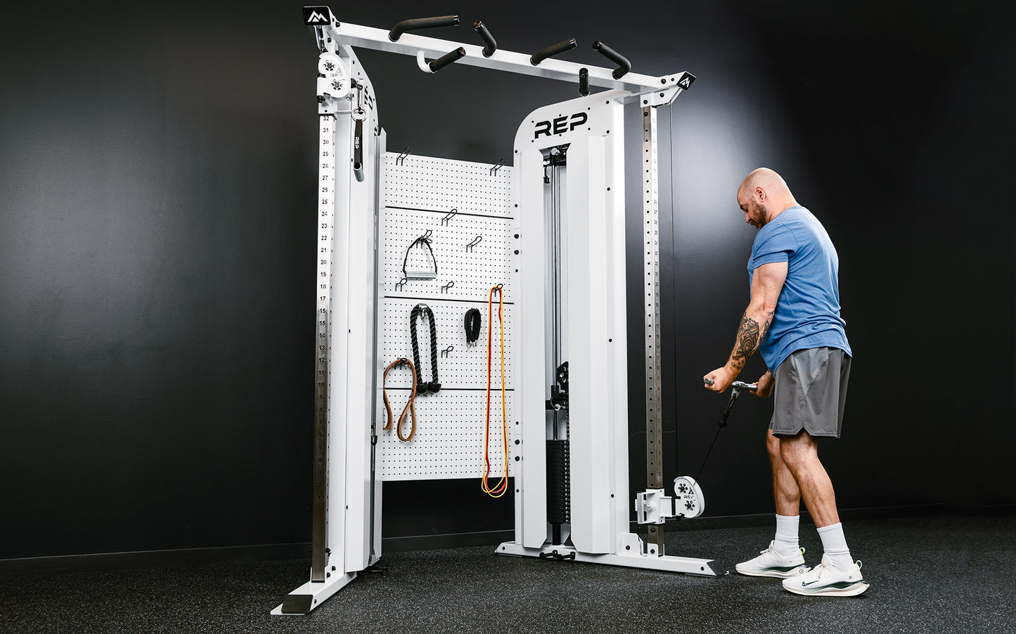 Rep Fitness - Arcadia Max functional trainer being used for bicep curls - White - Gym Equip