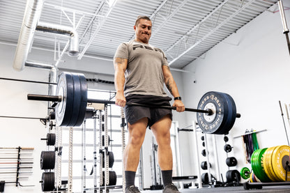 Rep Fitness - Black Diamond Black Cerakote with weights being deadlifted - Gym Equip