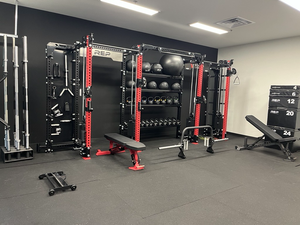 Commercial gym setup featuring 2 Rep PR5000 racks with Athenas connected with Storage rack